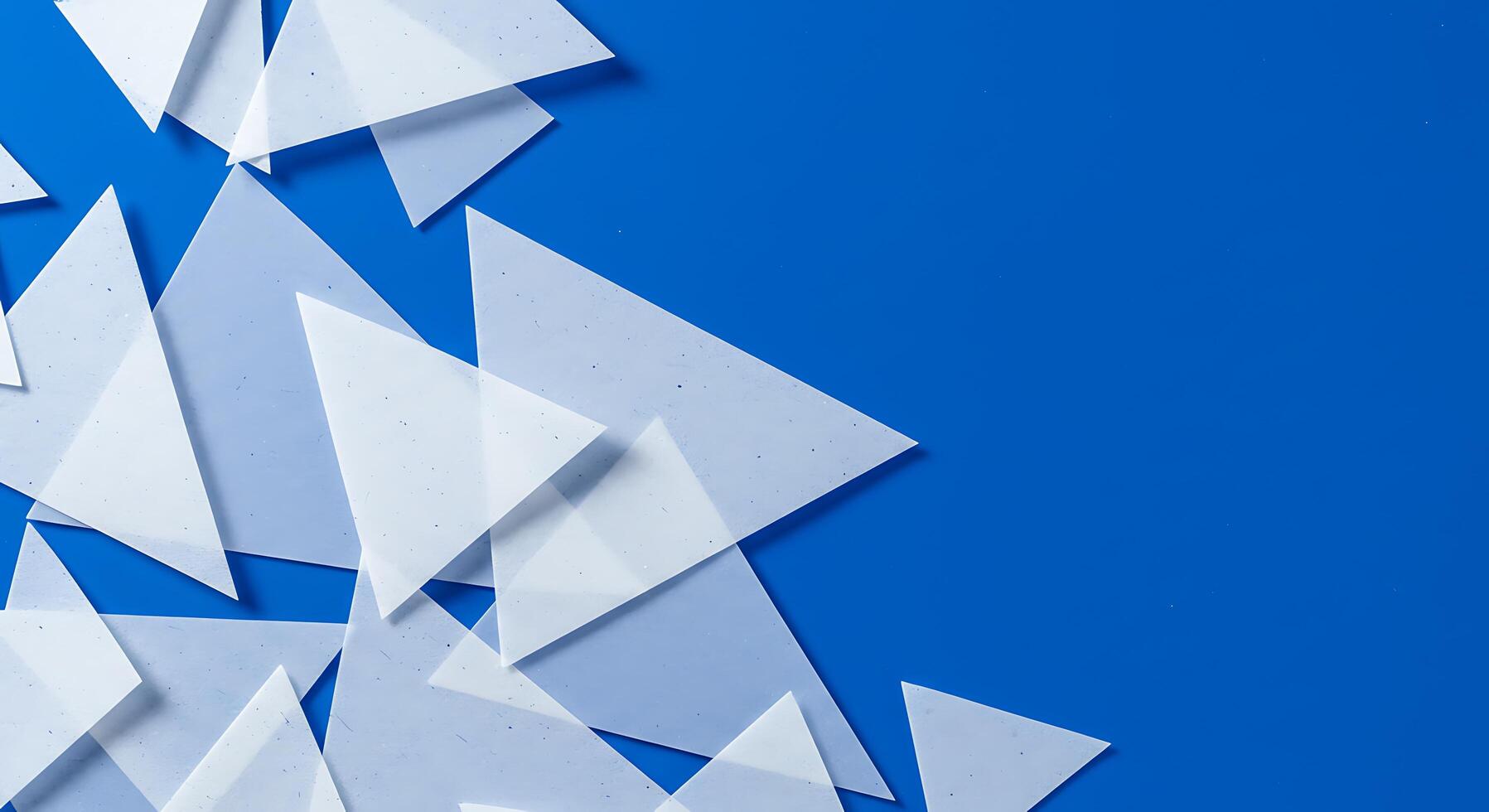A blue background with white triangles photo