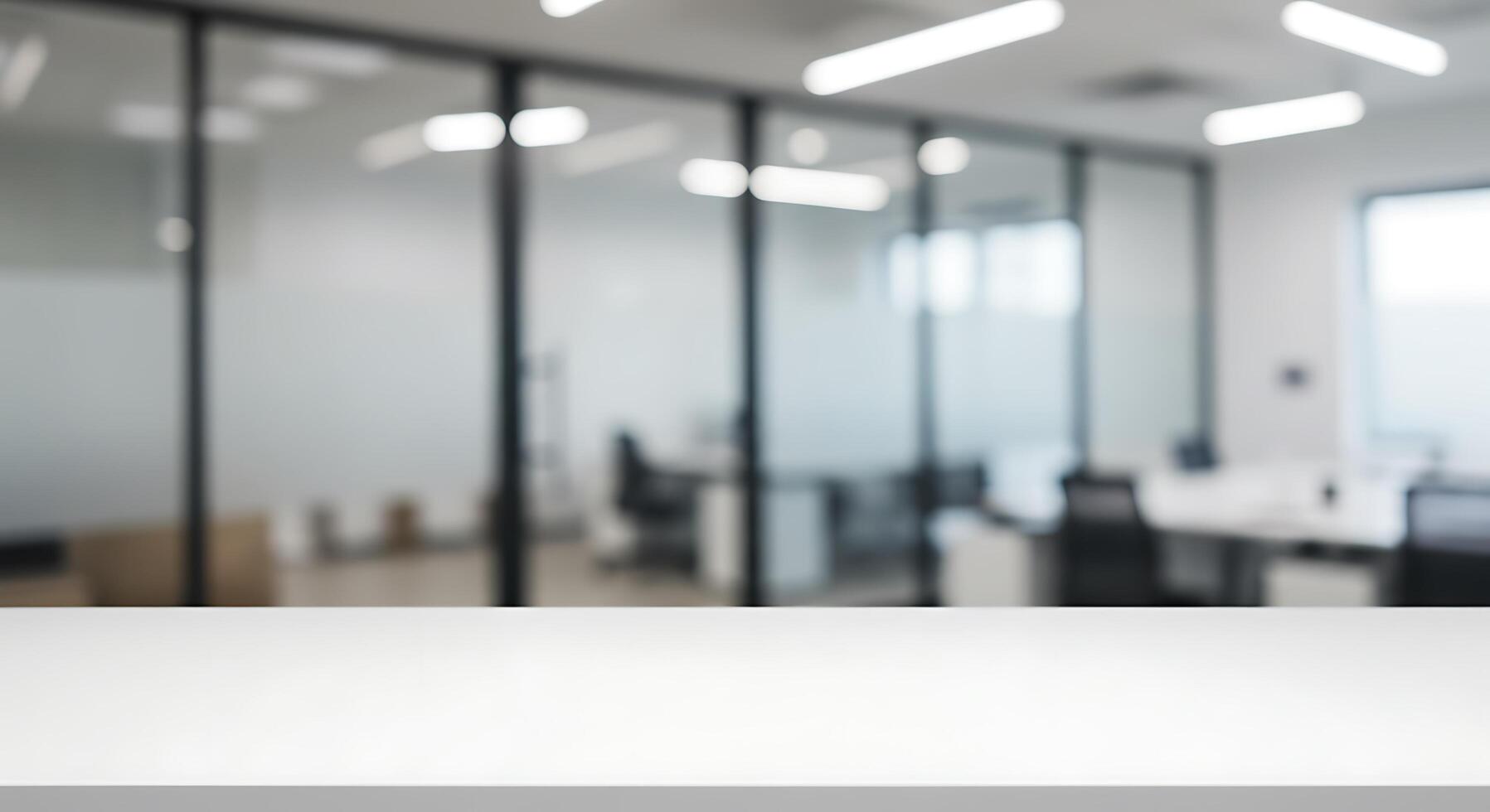 Empty table in an office with blurred glass walls photo