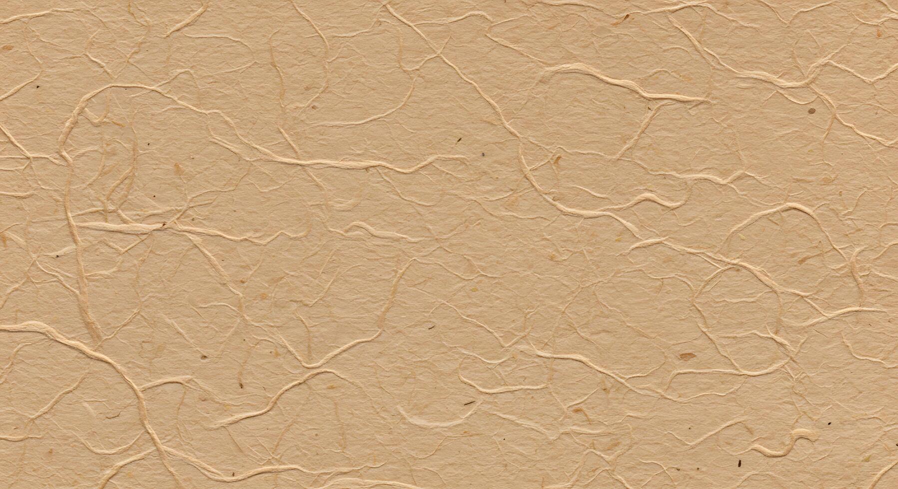 A brown paper texture with some small cracks photo