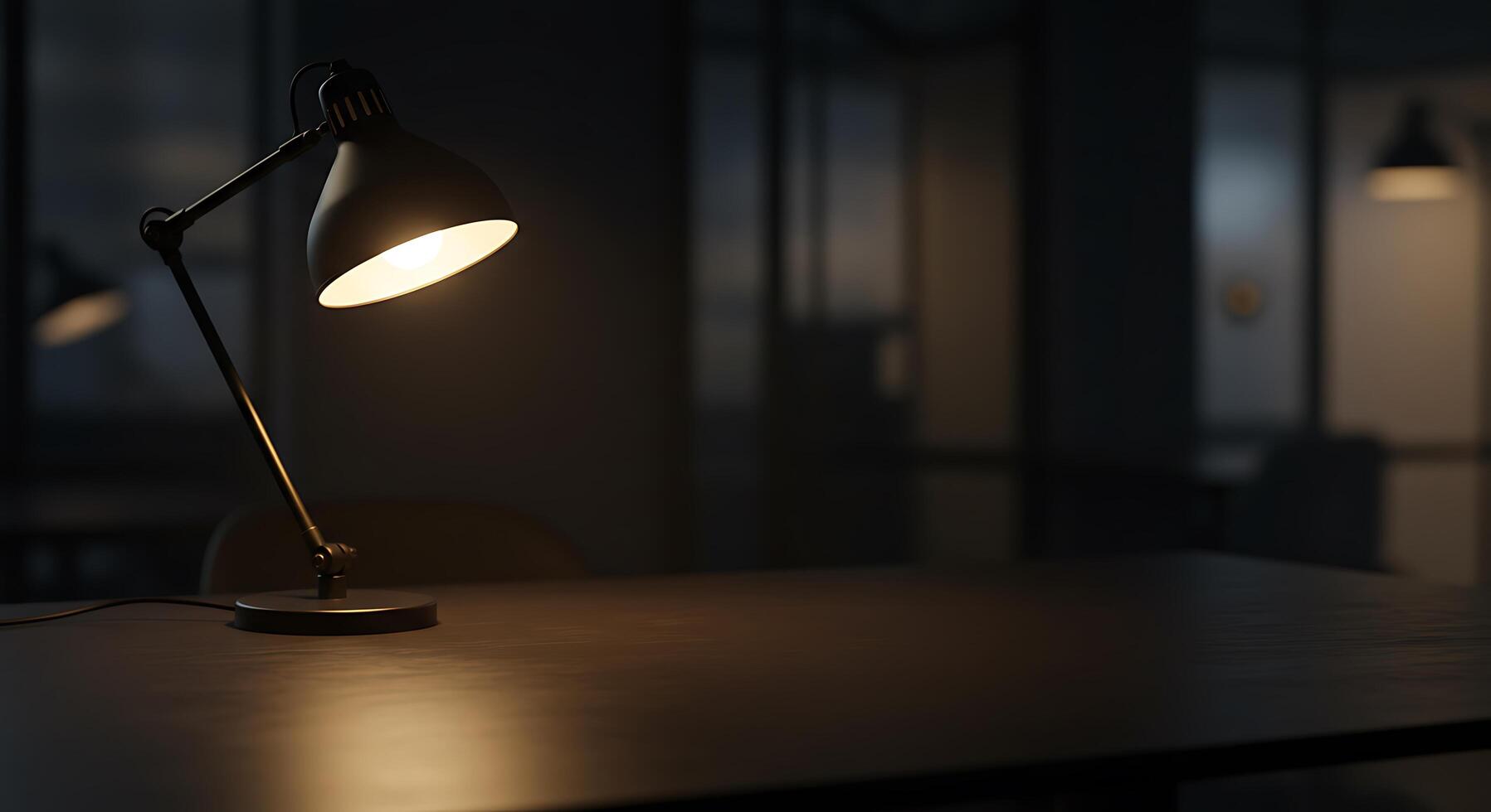 A desk lamp is on a table in a dark room photo