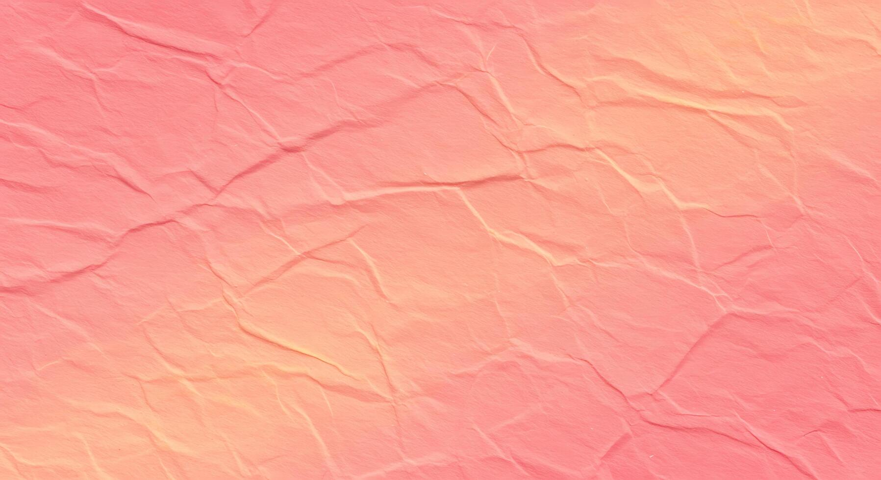 A pink crumpled paper texture with a yellow and orange color photo