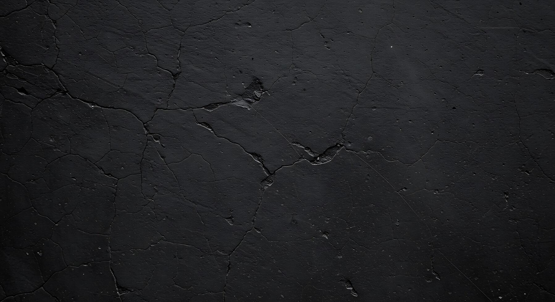 A black wall with cracks and a black paint photo