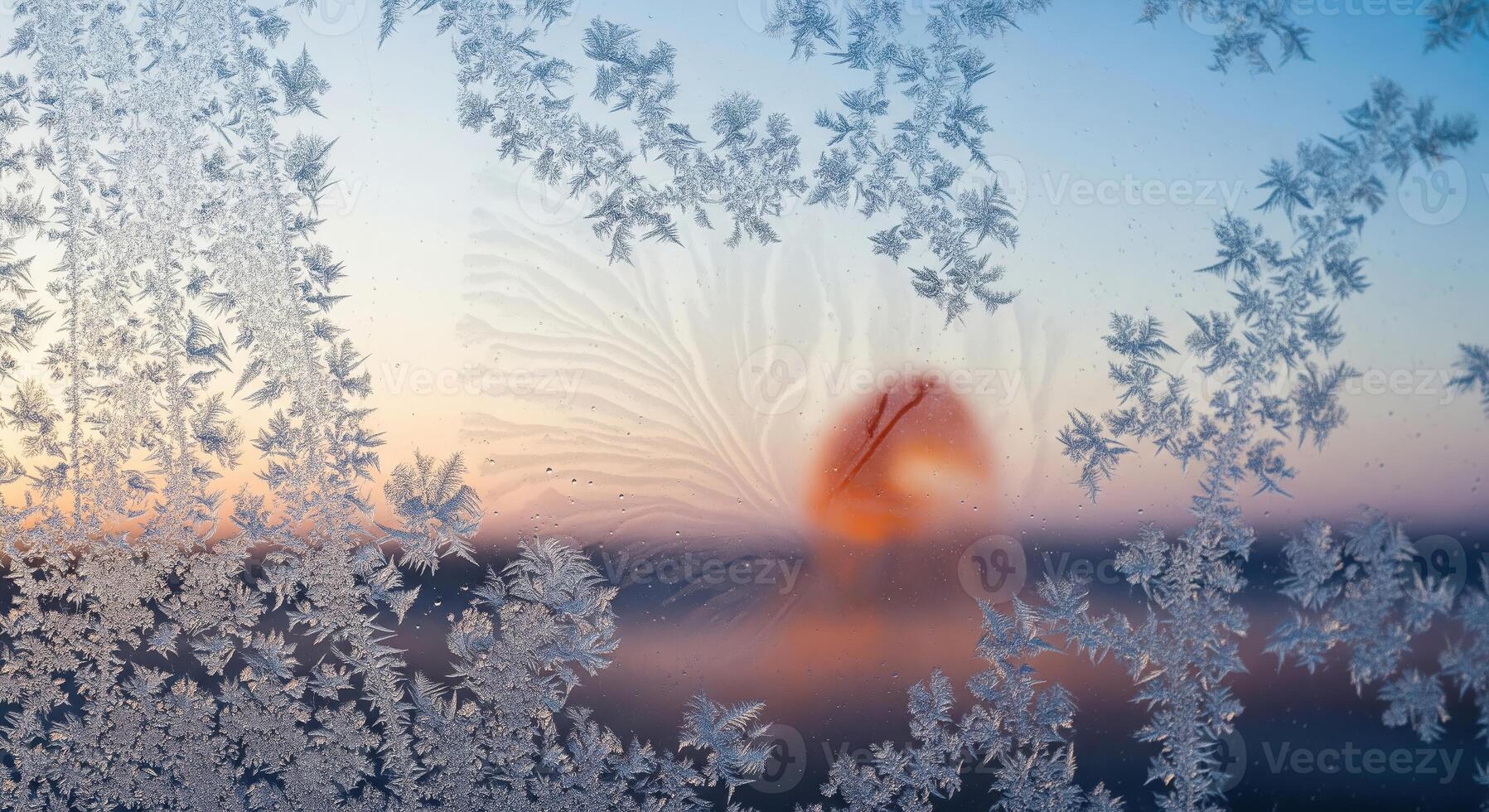 Frost on the window at sunset photo