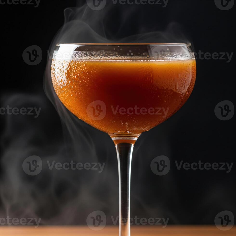 A glass of liquid with smoke coming out of it photo