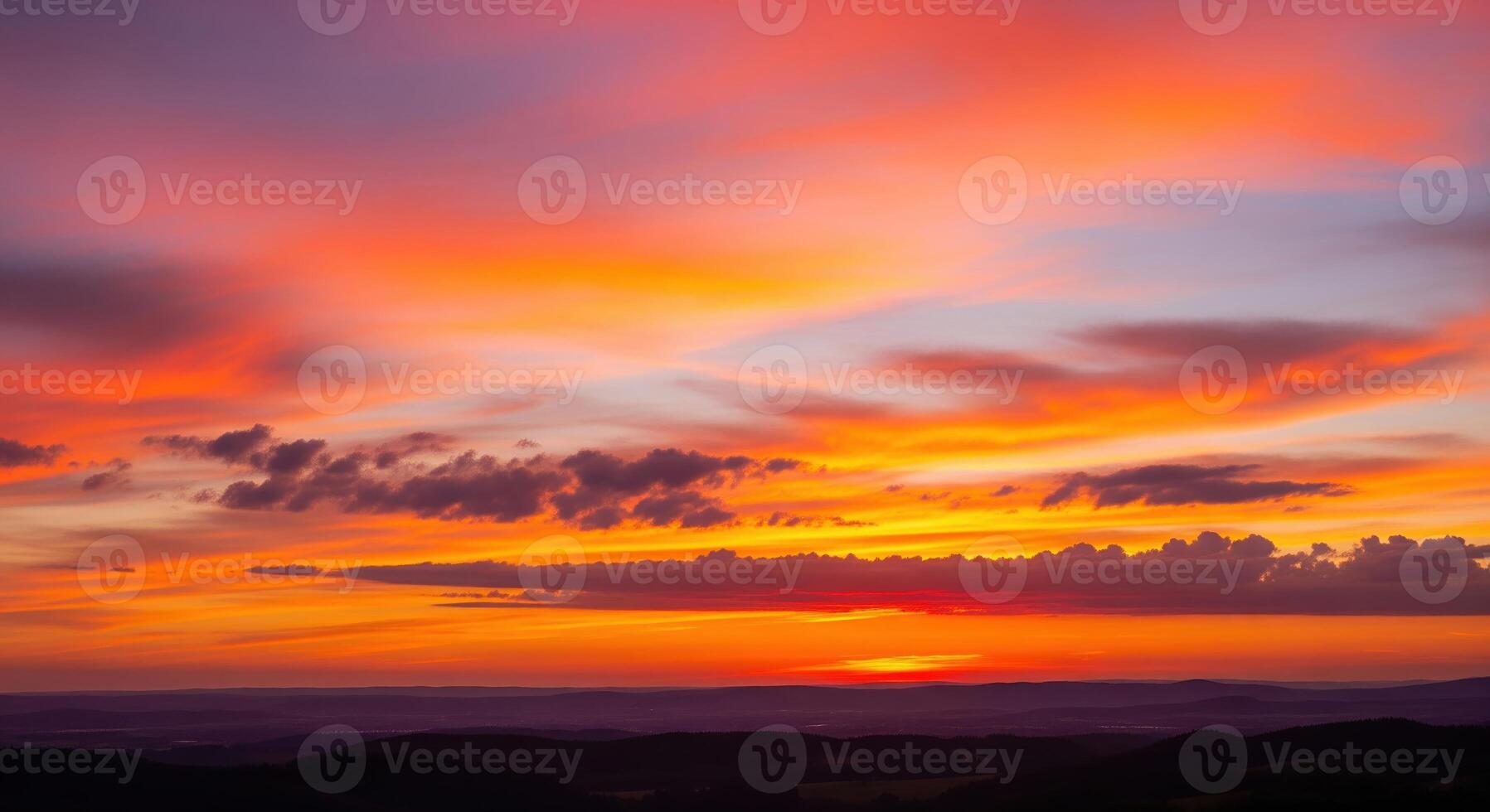 A sunset over a hill photo