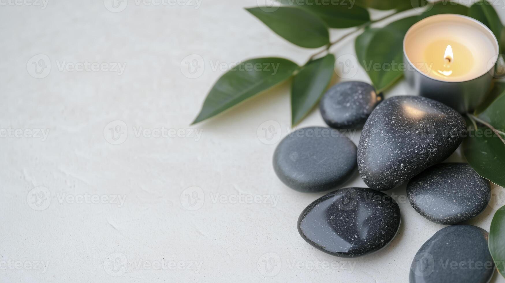 Spa stones and candle on white background photo