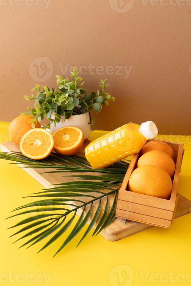 Fresh oranges and juice in vibrant setting photo