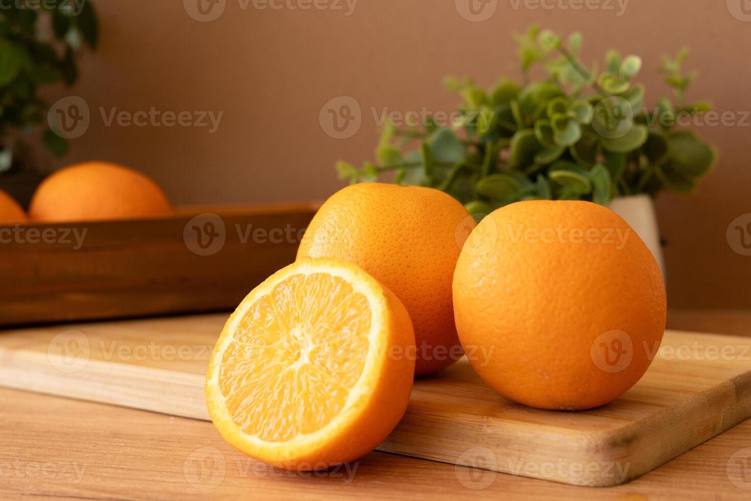 Fresh oranges on a cutting board photo