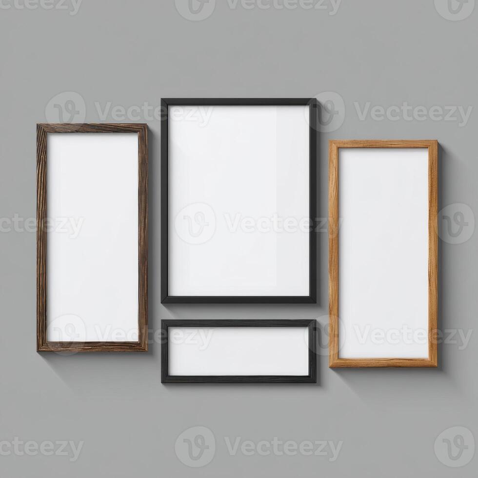 Three empty wooden frames on a gray wall photo