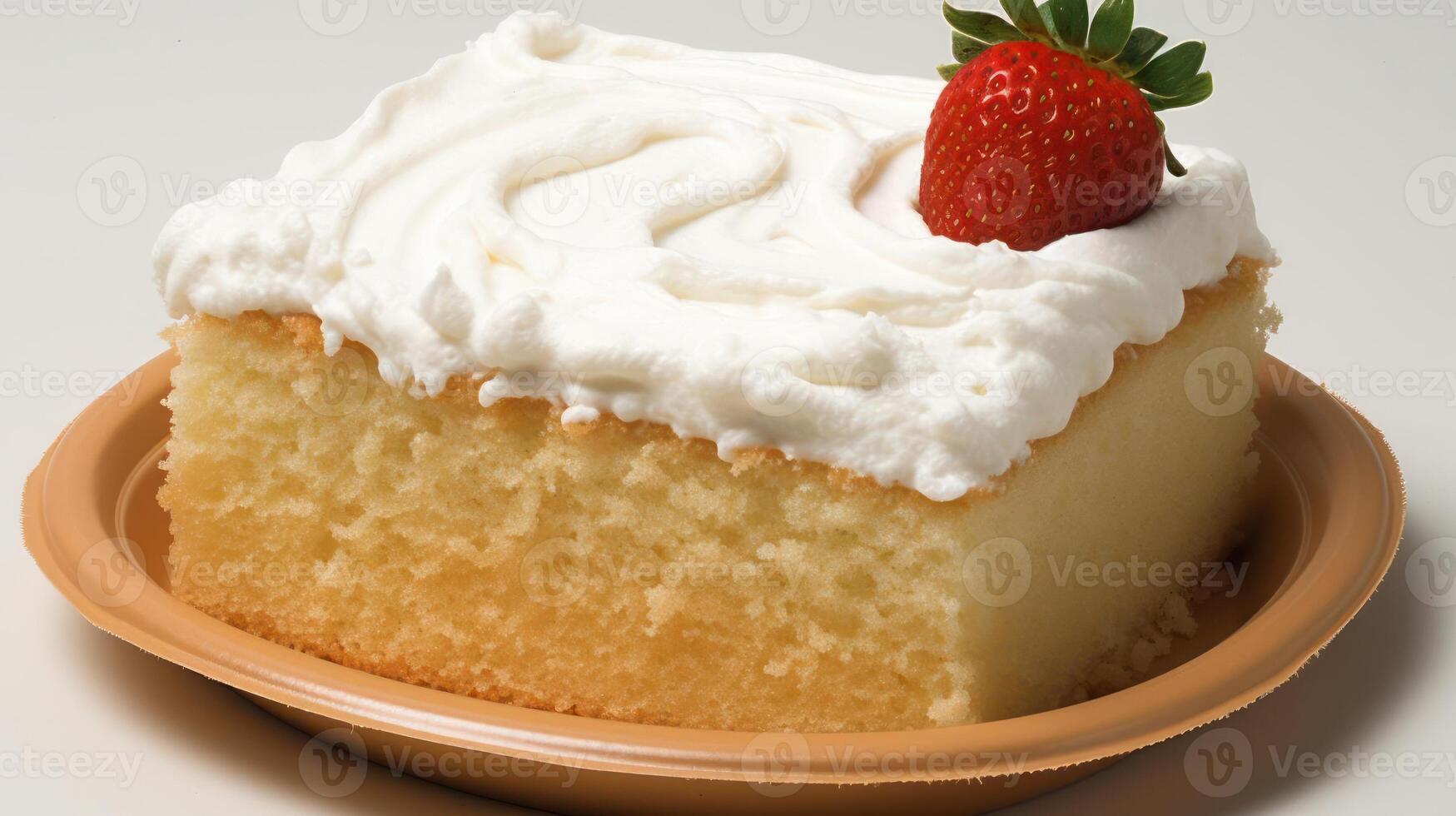 Vanilla cake slice with frosting and a strawberry. photo