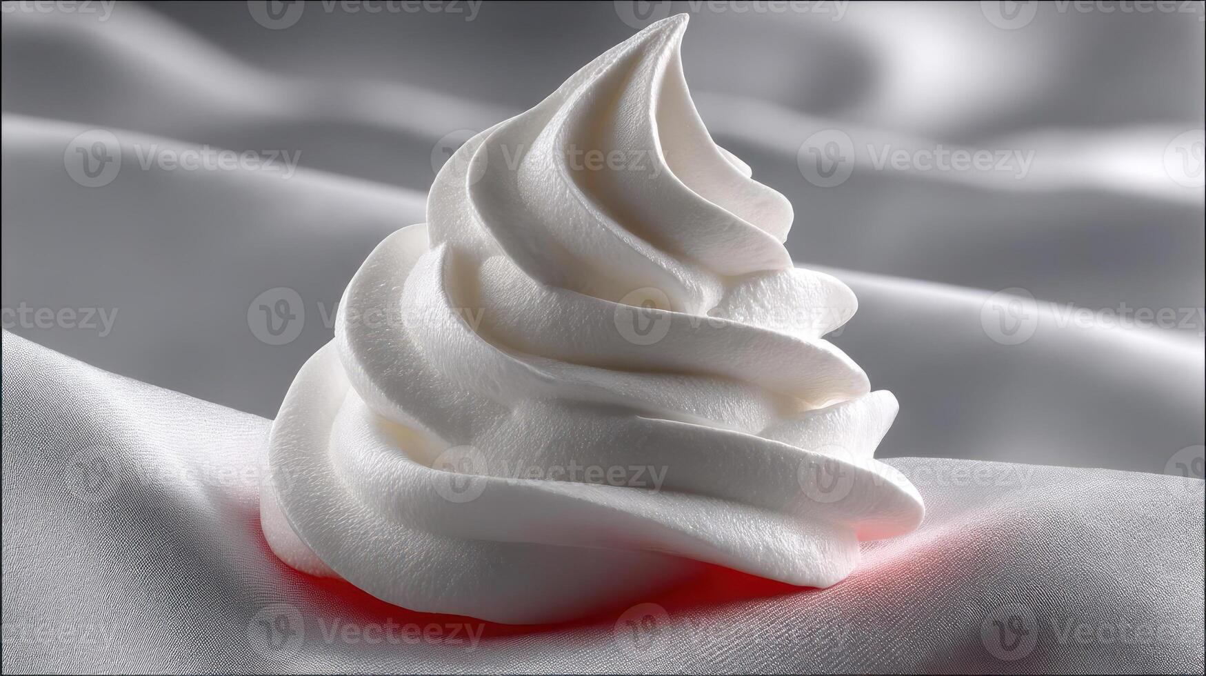 Detailed view of whipped cream on silk fabric. photo
