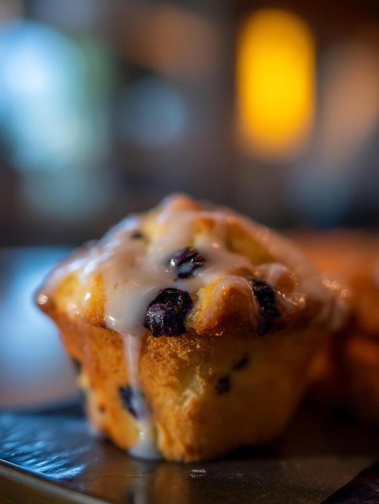 Close Up of a Delicious Blueberry Muffin with Icing. photo