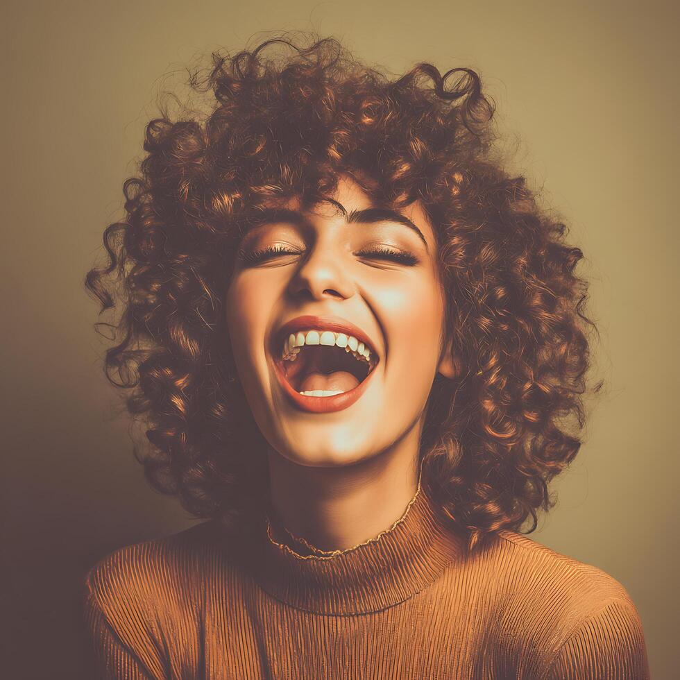 Joyful Woman with Curly Hair and Open Mouth Laugh. A close up portrait of a happy woman. photo