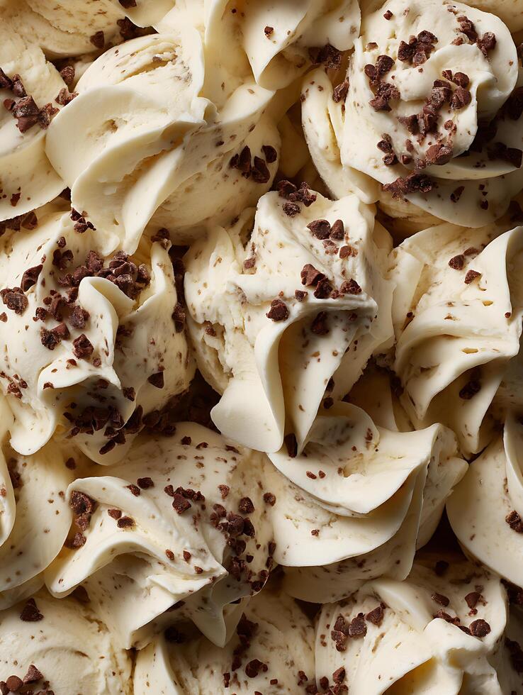 Close Up of Creamy Vanilla Ice Cream with Chocolate Chips. A detailed image showing the texture and deliciousness of the dessert. photo