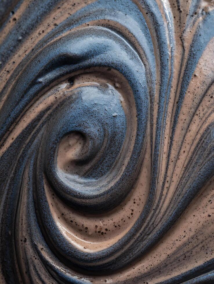 Abstract Swirled Texture Close Up of Blue and Brown Paint. photo