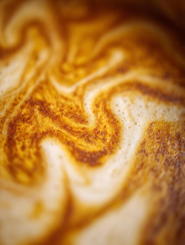 Close Up of Coffee Crema Swirling Textures and Colors. photo