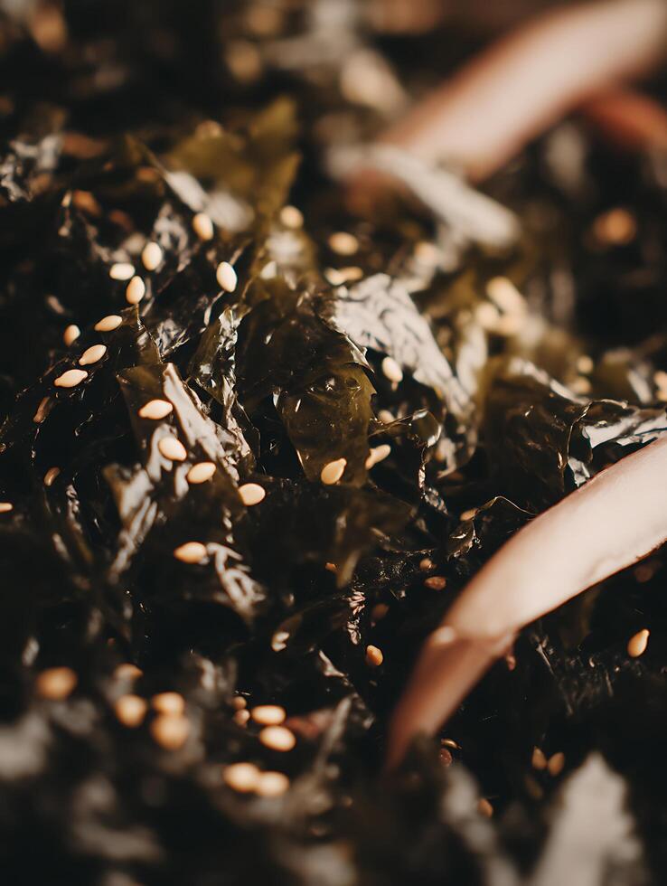 Close Up of Seaweed Salad with Sesame Seeds. A detailed image showcasing the texture and color of healthy seaweed. photo