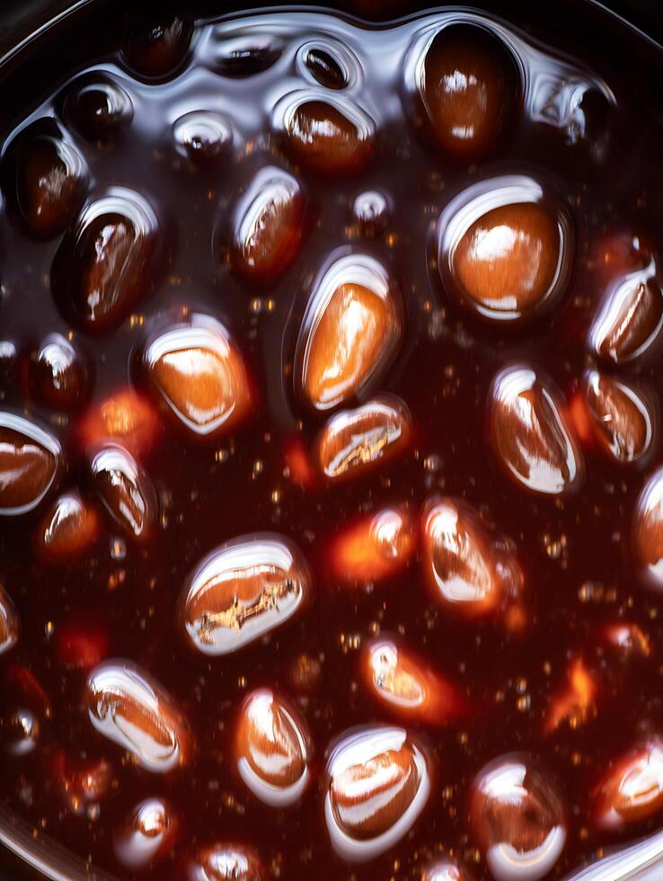 Close up of Coffee Beans Submerged in Dark Liquid, Rich Brown Hues. photo