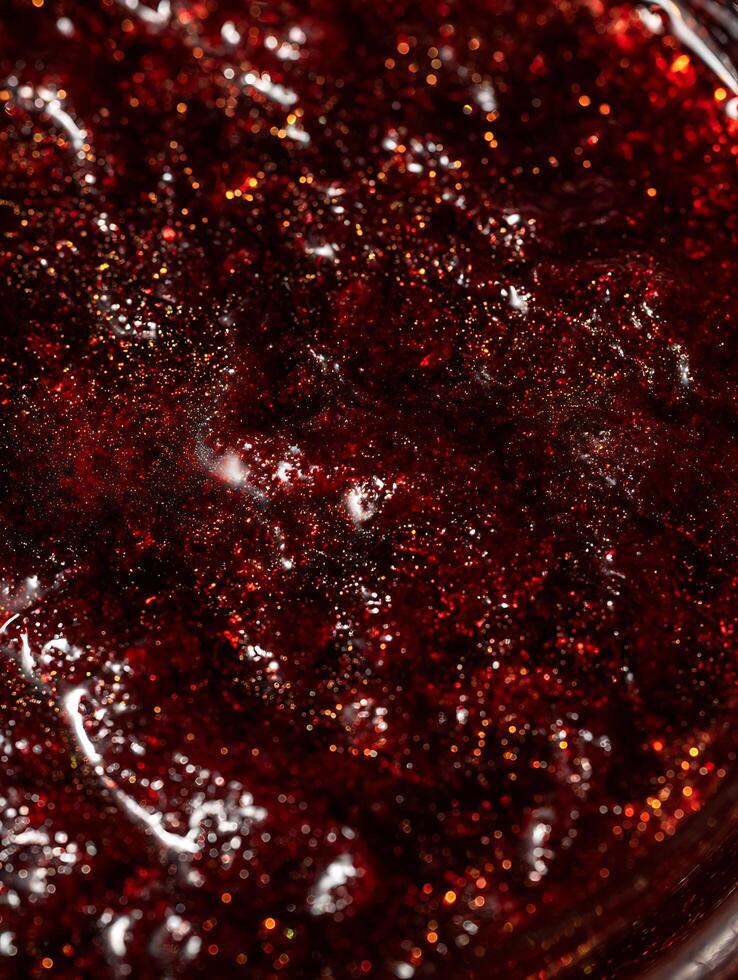 Close up of Red Glitter with Golden Sparkle. A Detailed Macro Shot of Shimmering Texture. photo
