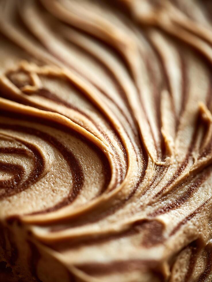 Close up of Swirled Brown and Beige Frosting Texture. A Detailed Image of Creamy Dessert Topping. photo