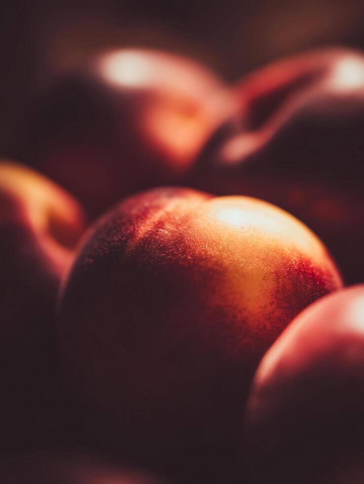 A Close Up of Ripe Nectarines, Illuminated by Warm Light. photo