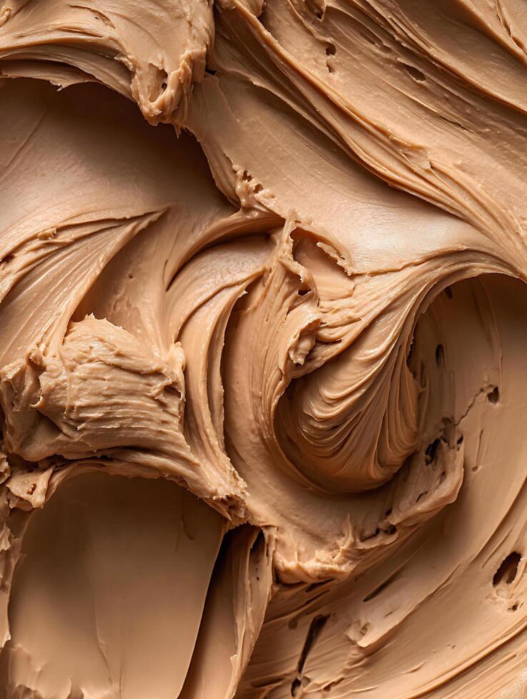 Creamy Swirls of Hazelnut Spread A Close Up Food Texture Image. photo
