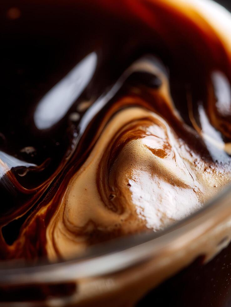 Close up of Coffee Crema Swirls Rich Brown and Creamy Texture. photo