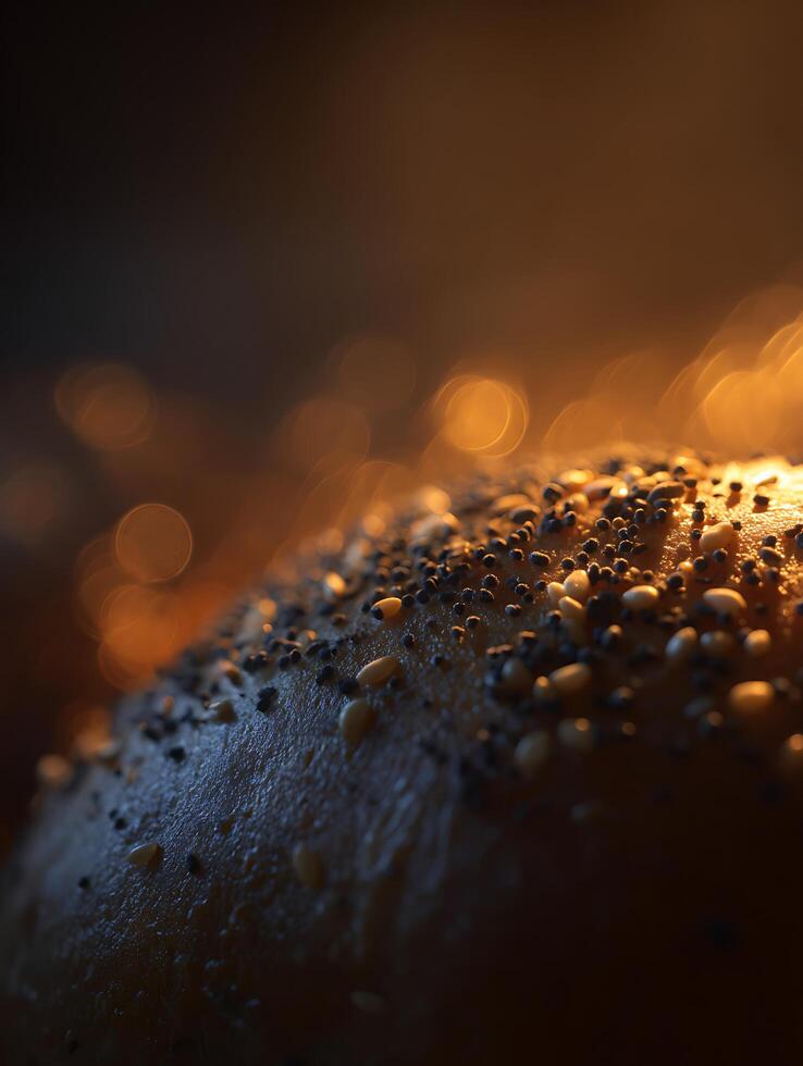 Close up of a Bread Roll Topped with Sesame and Poppy Seeds, Illuminated by Warm Light. photo