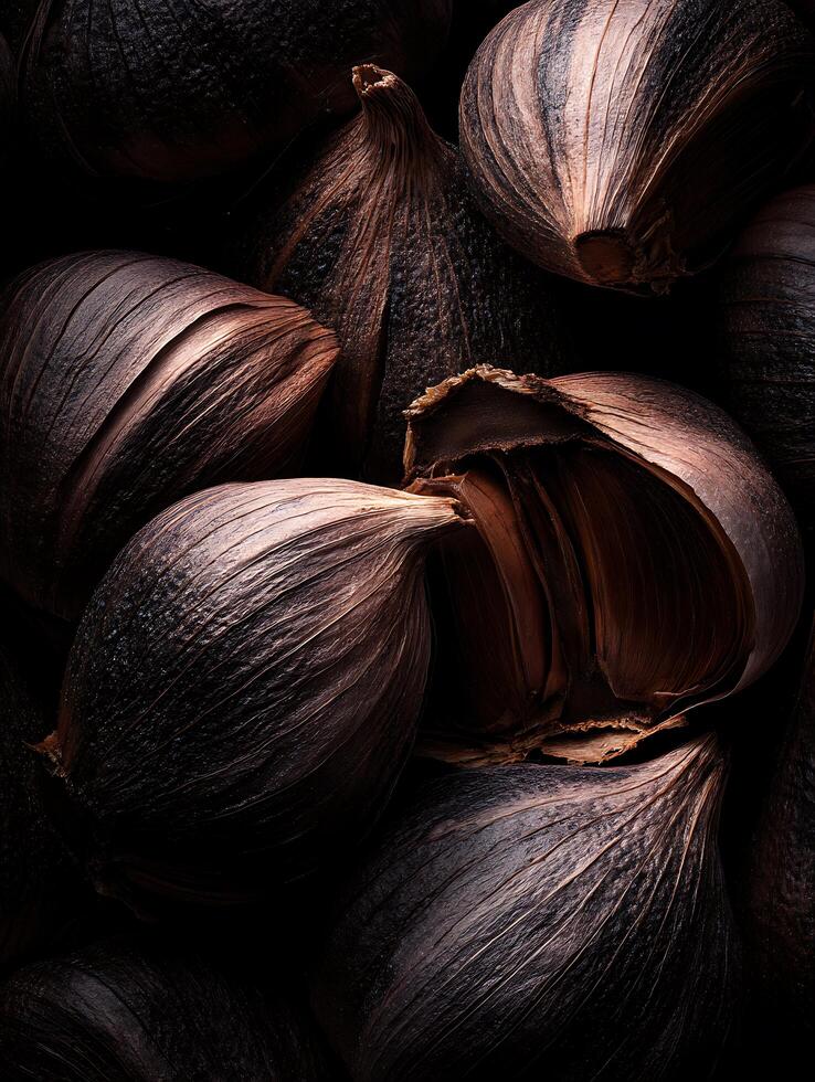 Close Up of Dark, Fermented Garlic Bulbs. A Detailed Image of Black Garlic Cloves. photo