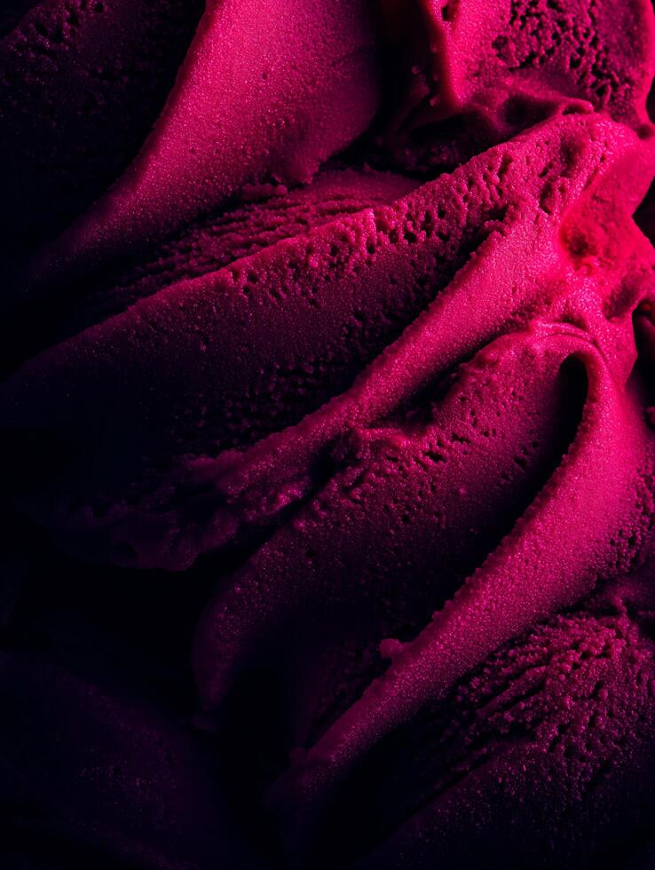 Close up of Deep Pink Ice Cream Texture, Swirling and Creamy Dessert. photo