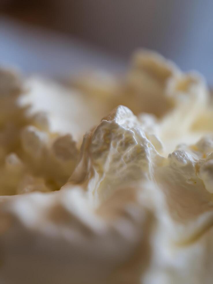 Close Up of Creamy Whipped Cream Texture, Delicious Dessert Background. photo