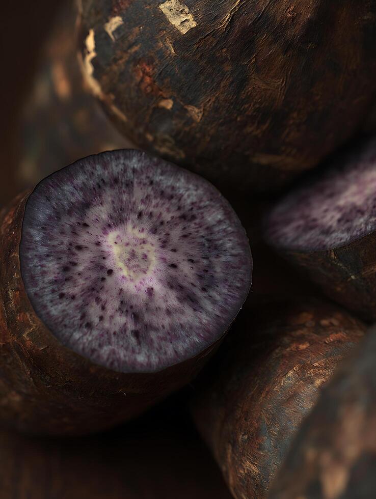 Close up of vibrant purple potato slices, revealing intricate texture and color. photo