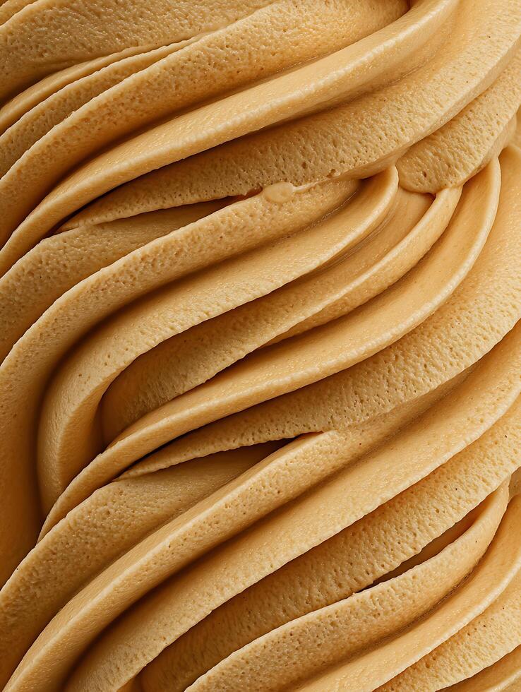 Close Up of Creamy Caramel Ice Cream Swirls, Rich Texture and Color. photo