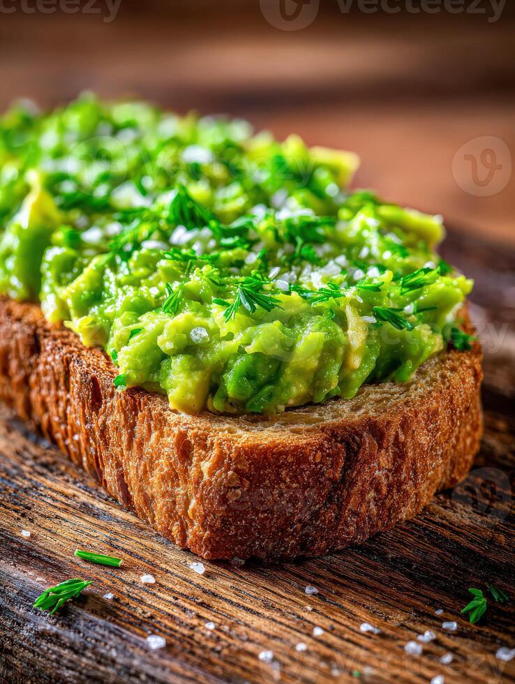 Avocado toast on wooden cutting board for tasty snack photo