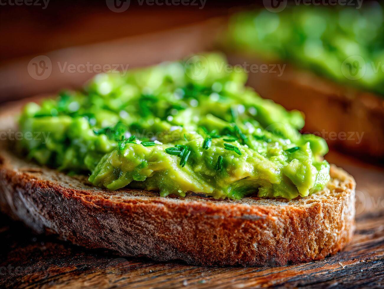 Avocado toast breakfast with herbs on a dark wooden table photo
