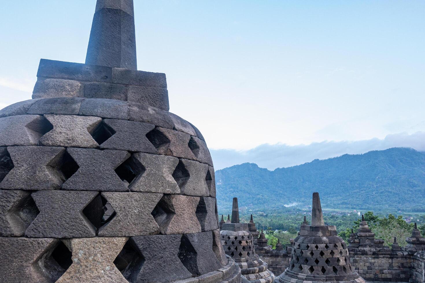 Close Up Stone Carved Stupa Details at Borobudur Temple Landscape photo