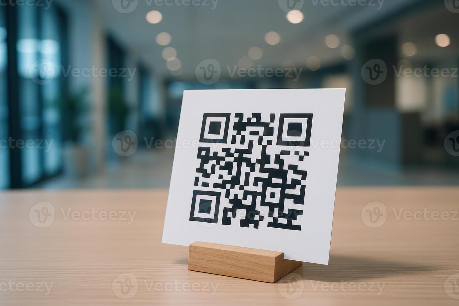 QR code on white card in wooden holder on table for digital scan and information photo