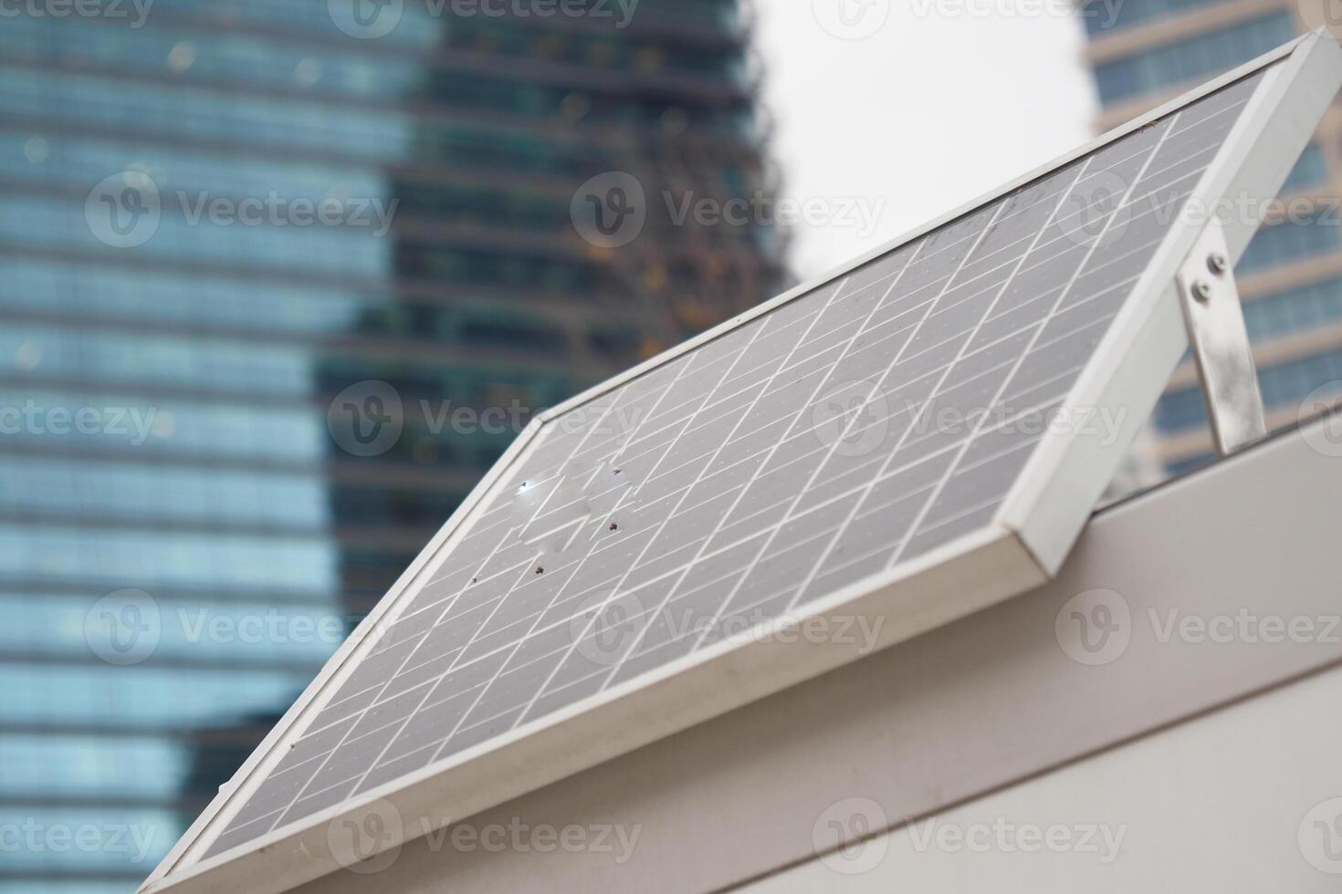 Solar panel installation on a modern building rooftop photo