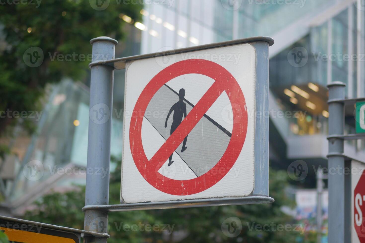 No walking allowed in busy urban area during peak time photo
