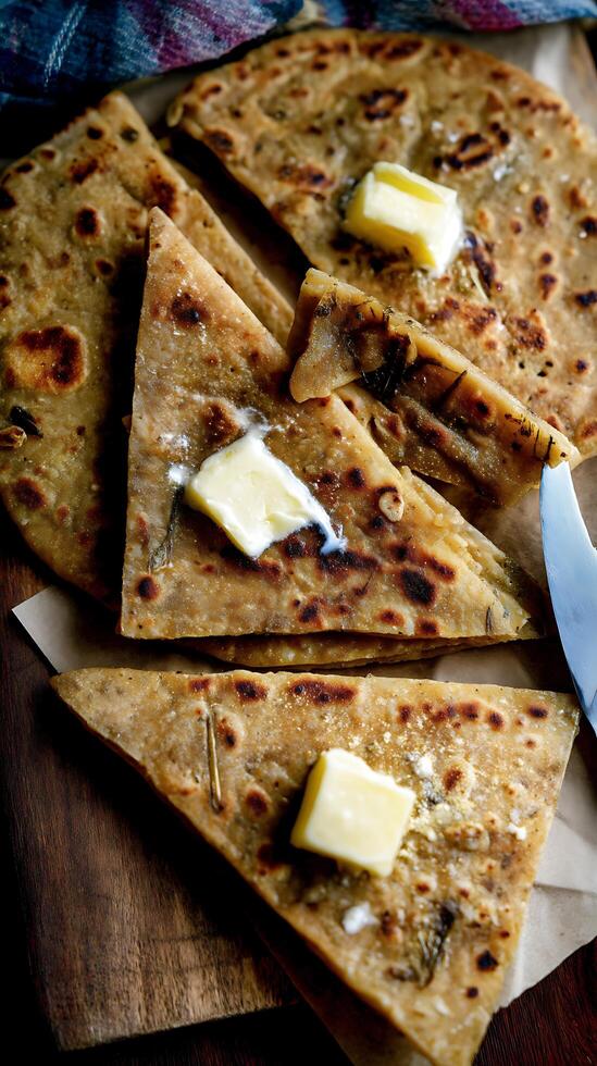 Close Up of Delicious Homemade Paratha Flatbreads with Melted Butter. photo