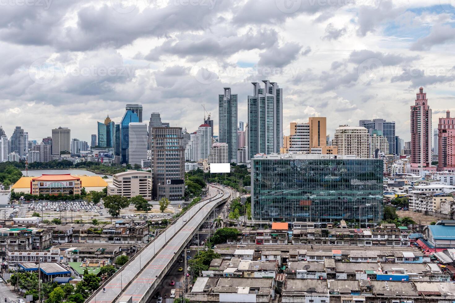 A city skyline with a highway and buildings photo