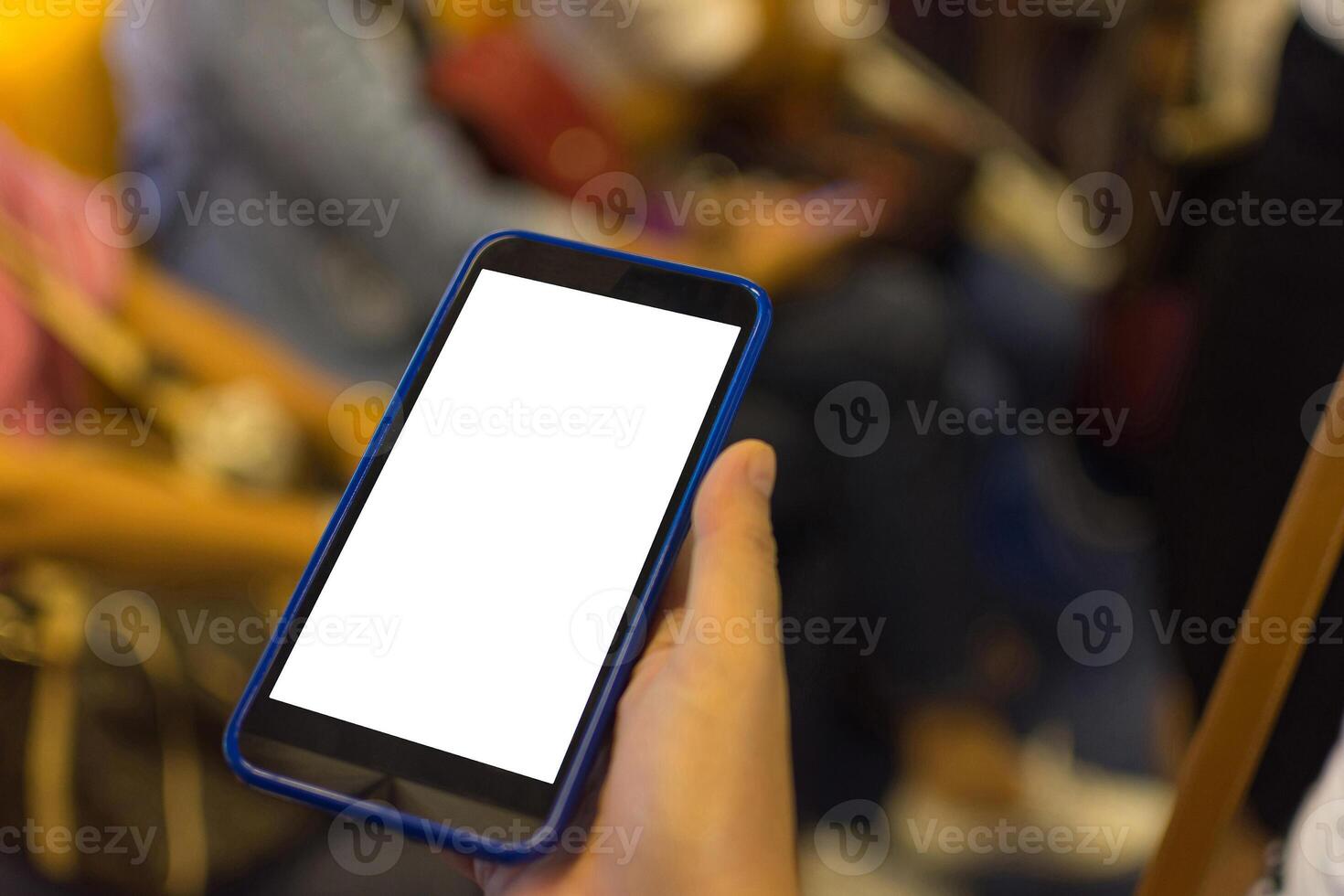 A person holding a cell phone with a blank screen photo
