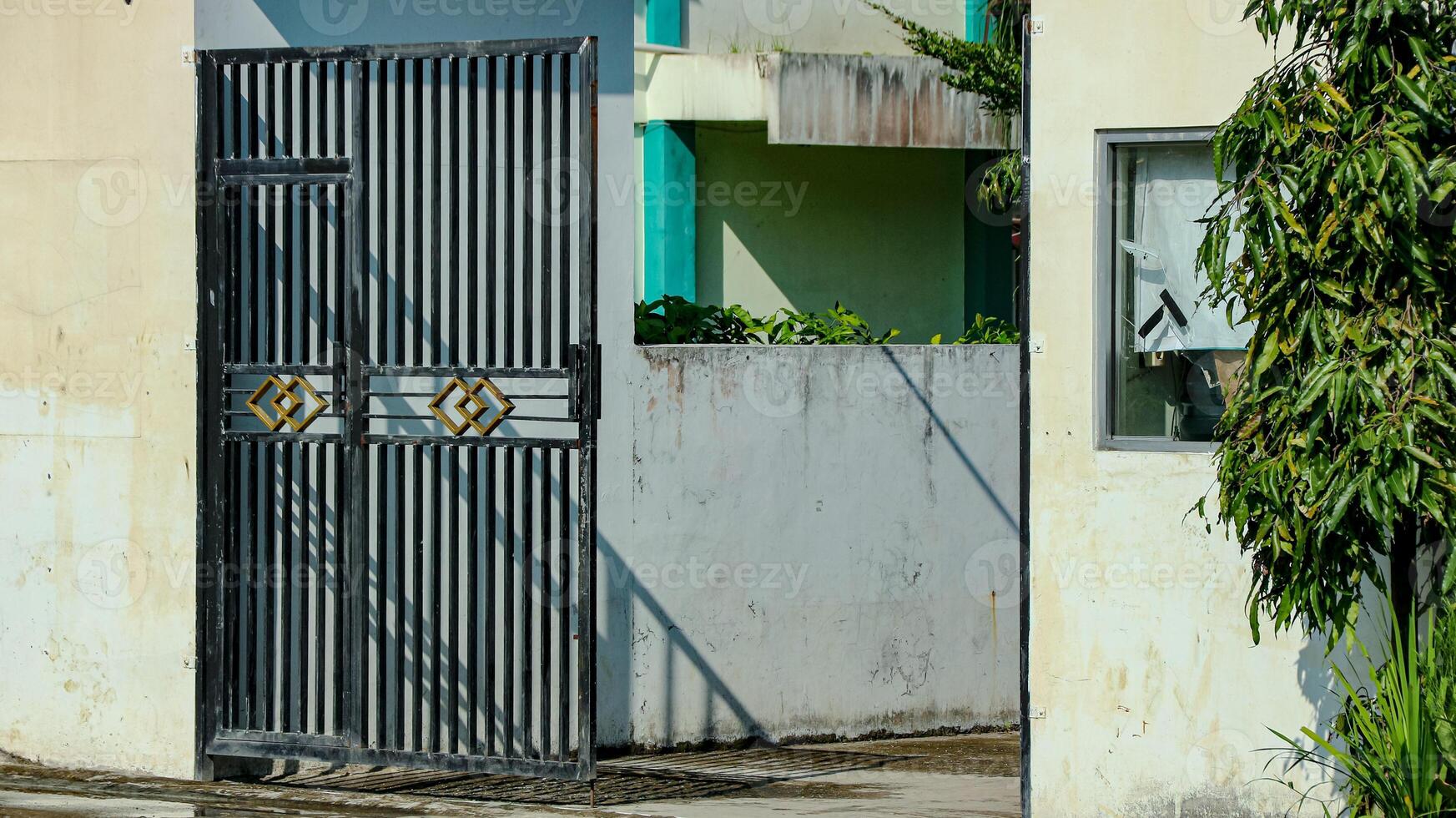 Iron Gate and Wall Exterior on Sunny Day Architecture photo