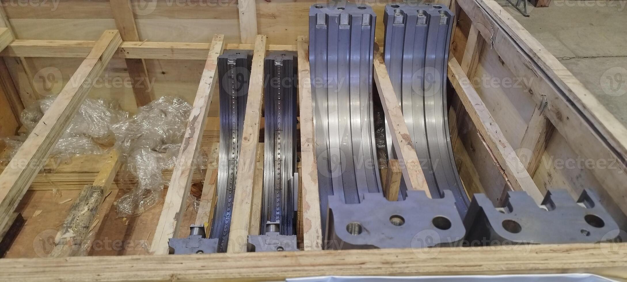 Turbine cylinder sleeve. PT 100. Turbine cylinder sleeve in a wooden crate. Metal industrial parts packaged. Precision-engineered components for machinery, ready for shipping and assembly. Shipping photo