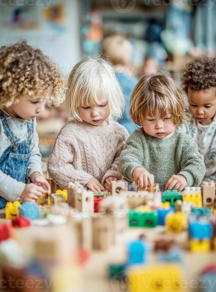 Diverse children playing with building blocks in kindergarten photo