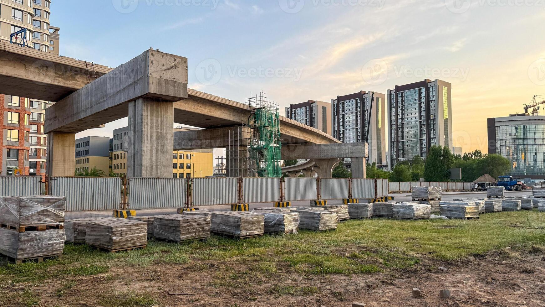 Future urban tapestry weaving silent stories, concrete skeletons rise under dawns embrace, honoring Earth Day and World Architecture Day photo
