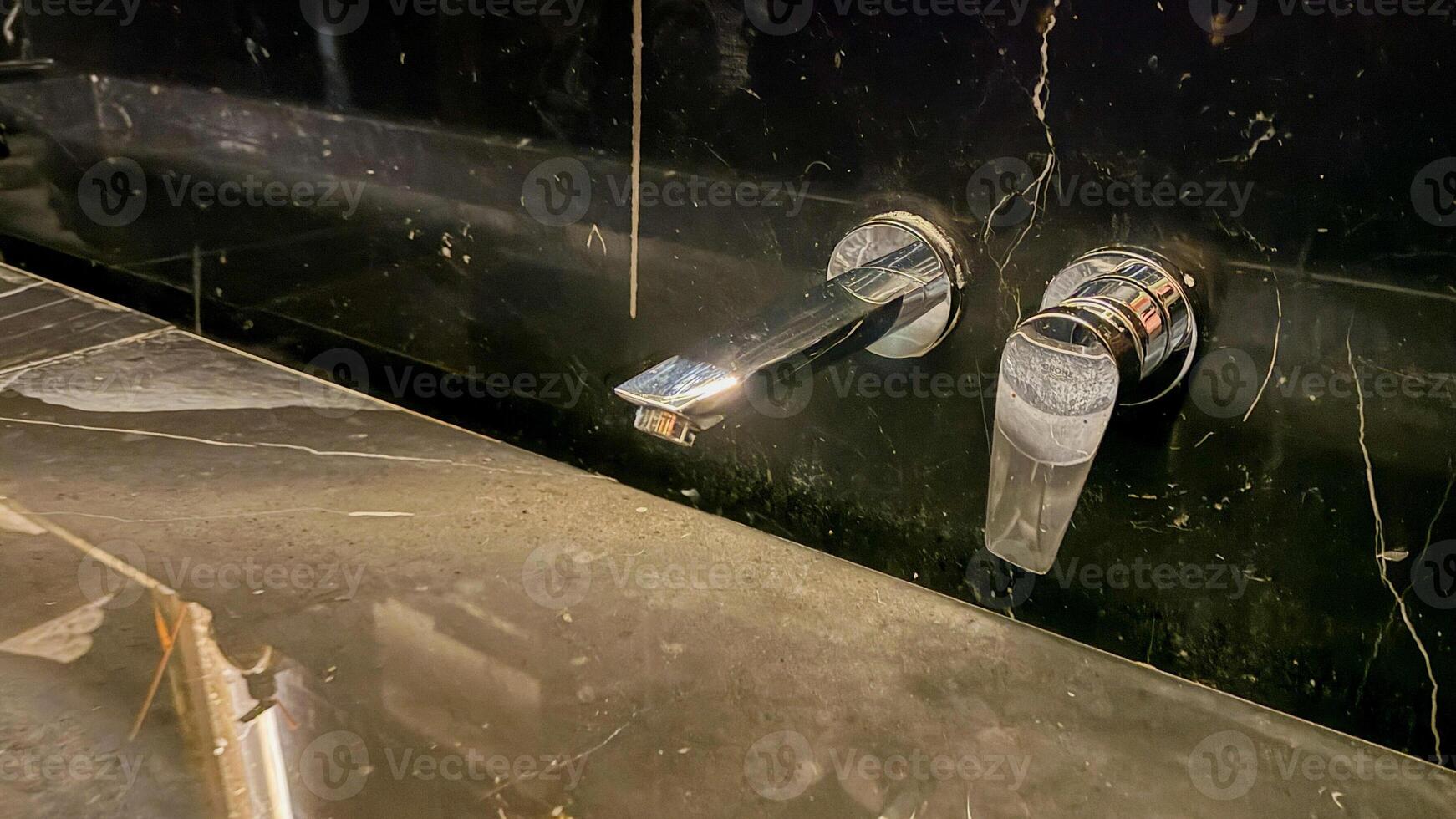 Gleaming chrome faucet over marble sink, futuristic water ceremony, Zen purification, alchemy of cleanliness, International Hygiene Day ambiance photo