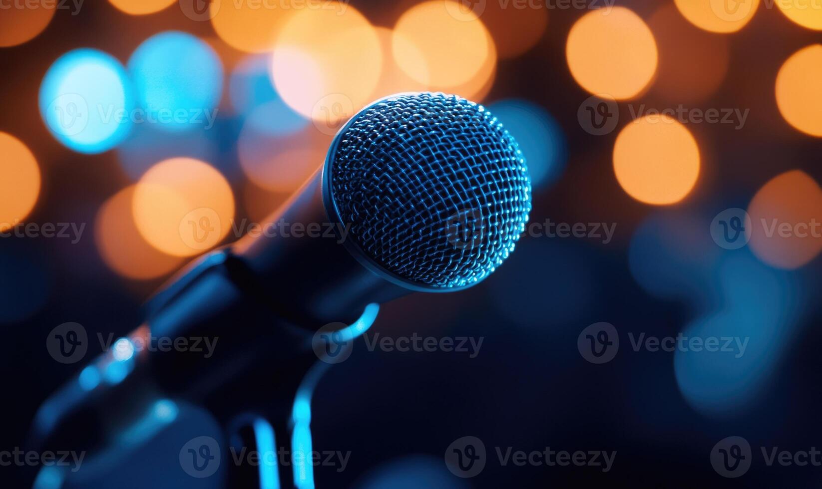 A microphone is shown with a blurry background photo