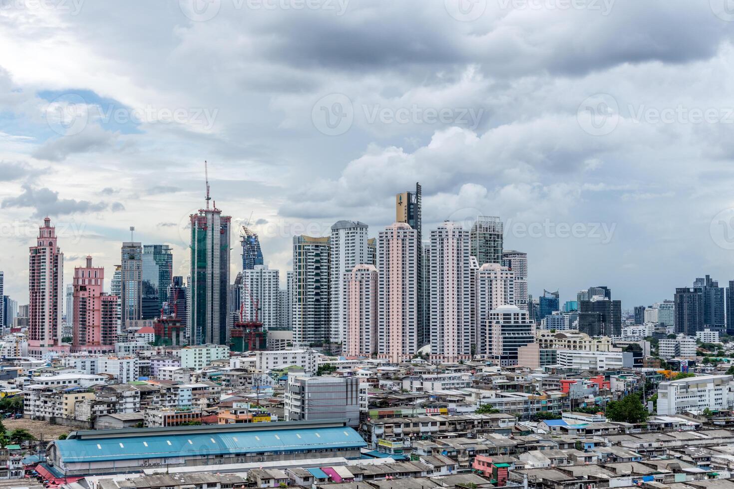 A city skyline with tall buildings and lots of people photo