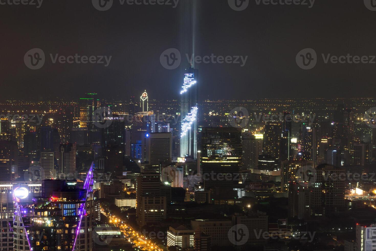 The city is lit up at night photo